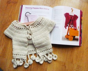 Dancing poppies baby bolero, Sylvie Damey, ChezPlum.com, from book "101 one skein crochet projects"
